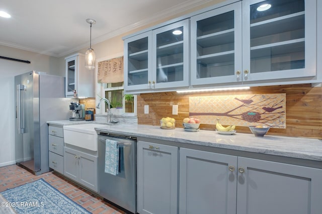 209 Irene Cir, Lafayette, LA 70503 - kitchen with backsplash, brick flooring, ornamental molding, appliances with stainless steel finishes, and glass insert cabinets