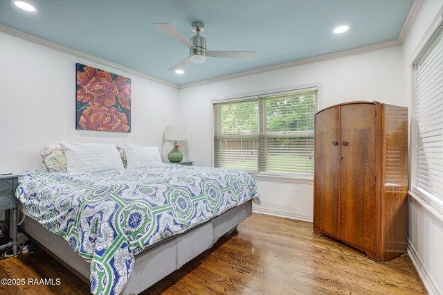 209 Irene Cir, Lafayette, LA 70503 - bedroom with wood finished floors, ornamental molding, recessed lighting, baseboards, and a ceiling fan