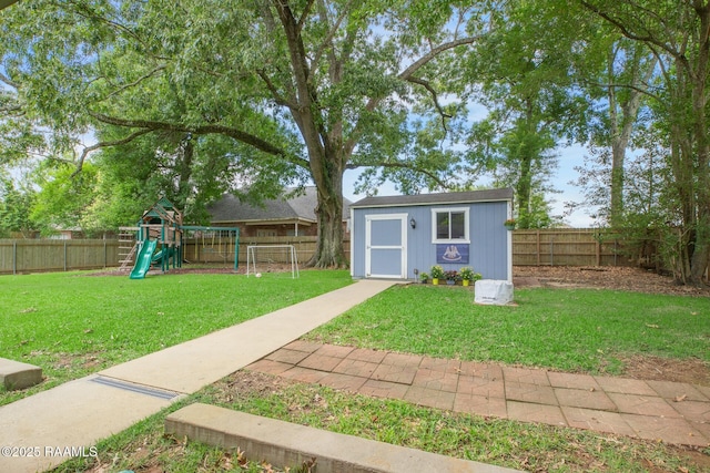 209 Irene Cir, Lafayette, LA 70503 - view of yard with a playground, a shed, and an outbuilding