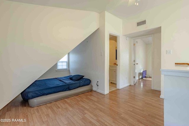 259 Chatrian St, Grand Coteau, LA 70541 - bedroom featuring light wood finished floors and ensuite bathroom