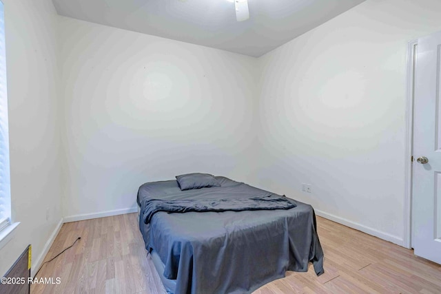 259 Chatrian St, Grand Coteau, LA 70541 - bedroom featuring light wood-style floors, baseboards, and ceiling fan