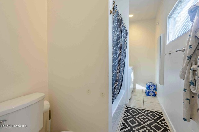 259 Chatrian St, Grand Coteau, LA 70541 - bathroom featuring toilet, tile patterned flooring, and shower / tub combo