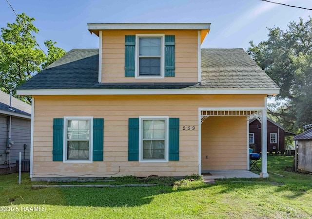 259 Chatrian St, Grand Coteau, LA 70541 - view of front of property with a front yard and roof with shingles