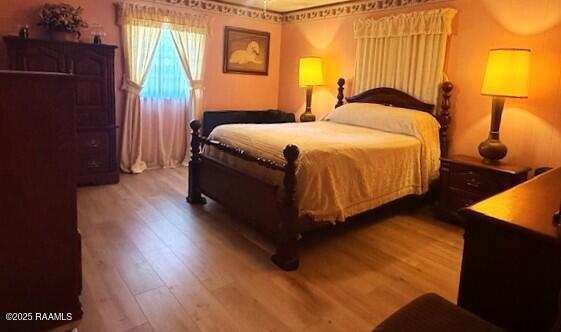 bedroom featuring wood finished floors