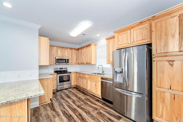 104 Trout Ct, Dulac, LA 70353 - kitchen featuring appliances with stainless steel finishes, light brown cabinets, a sink, ornamental molding, and tasteful backsplash