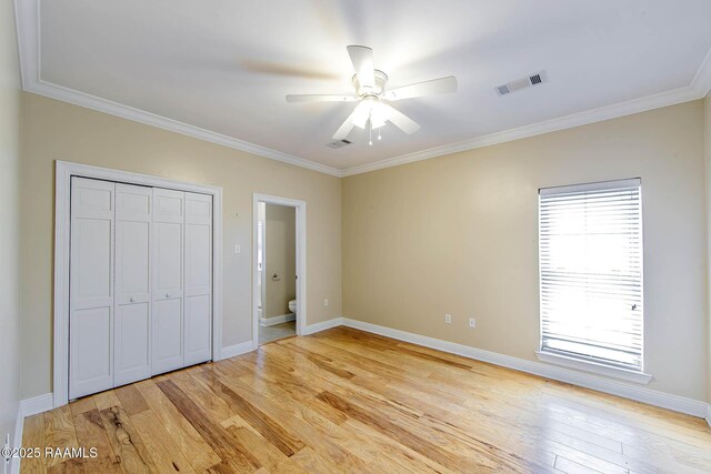 104 Trout Ct, Dulac, LA 70353 - unfurnished bedroom with crown molding, light wood-type flooring, a closet, baseboards, and a ceiling fan