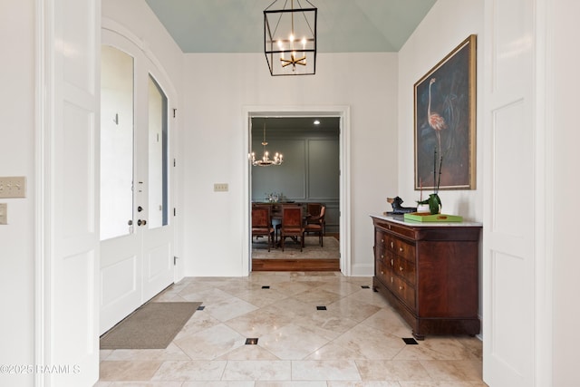 100 Emily Cir, Lafayette, LA 70508 - foyer entrance featuring a chandelier, baseboards, arched walkways, and light tile patterned floors