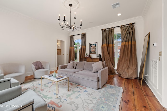 100 Emily Cir, Lafayette, LA 70508 - living area with a chandelier, healthy amount of natural light, hardwood / wood-style floors, ornamental molding, and baseboards