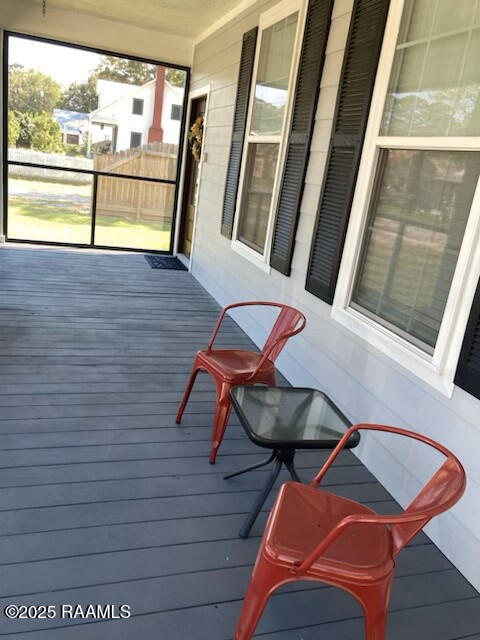 236 Chatrian St, Grand Coteau, LA 70541 - wooden deck featuring a porch