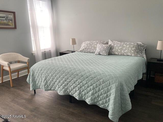 236 Chatrian St, Grand Coteau, LA 70541 - bedroom with wood finished floors and baseboards