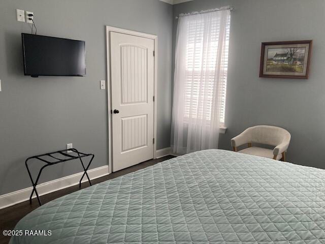 236 Chatrian St, Grand Coteau, LA 70541 - bedroom with baseboards and wood finished floors