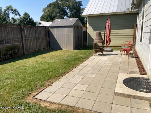 236 Chatrian St, Grand Coteau, LA 70541 - view of yard featuring a patio, a storage shed, and an outdoor structure