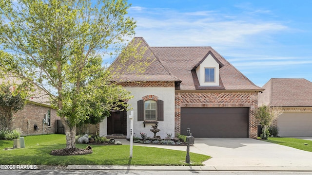 108 Autumnbrook Dr, Broussard, LA 70518 - view of front of house featuring a front lawn, driveway, stucco siding, brick siding, and a garage