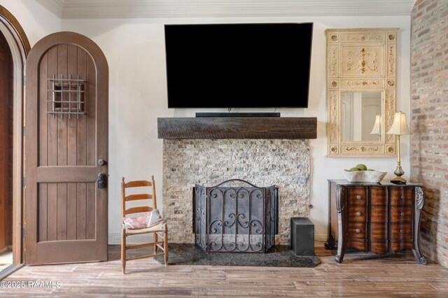 108 Autumnbrook Dr, Broussard, LA 70518 - living room featuring wood finished floors, a fireplace, and ornamental molding