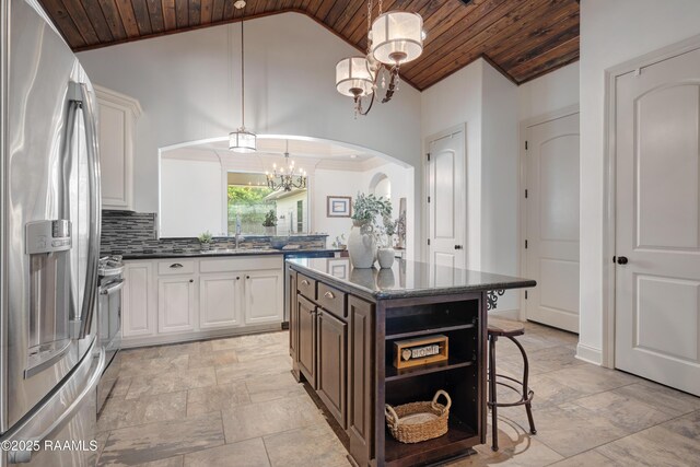 108 Autumnbrook Dr, Broussard, LA 70518 - kitchen with stainless steel appliances, wooden ceiling, vaulted ceiling, arched walkways, and a chandelier