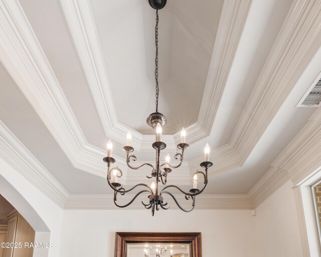 108 Autumnbrook Dr, Broussard, LA 70518 - detailed view of crown molding, a chandelier, a tray ceiling, and arched walkways
