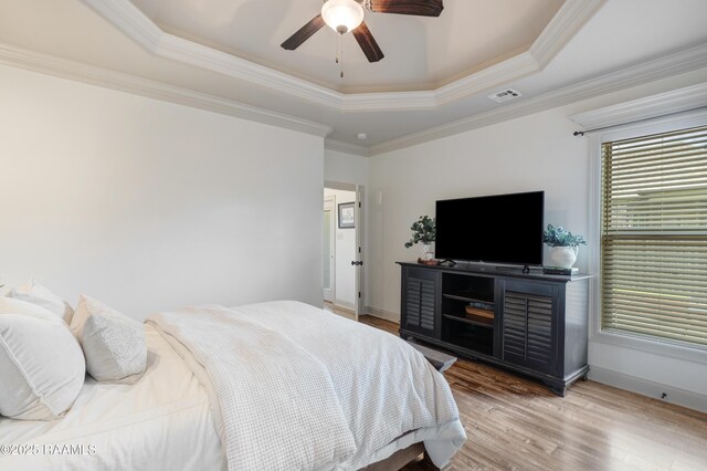 108 Autumnbrook Dr, Broussard, LA 70518 - bedroom featuring a tray ceiling, wood finished floors, baseboards, ornamental molding, and ceiling fan