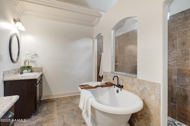 108 Autumnbrook Dr, Broussard, LA 70518 - bathroom with vanity, a soaking tub, ornamental molding, stone finish floors, and tile walls