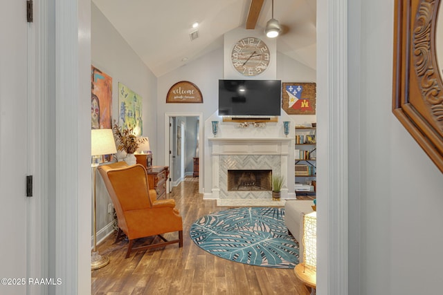 112 Sandhill Crane Dr, Lafayette, LA 70508 - living area featuring wood finished floors, beam ceiling, a fireplace, high vaulted ceiling, and baseboards