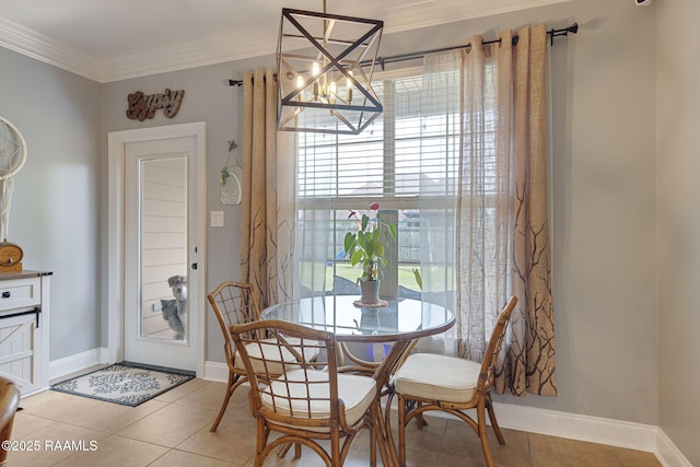 112 Sandhill Crane Dr, Lafayette, LA 70508 - dining area with a chandelier, crown molding, light tile patterned floors, and baseboards