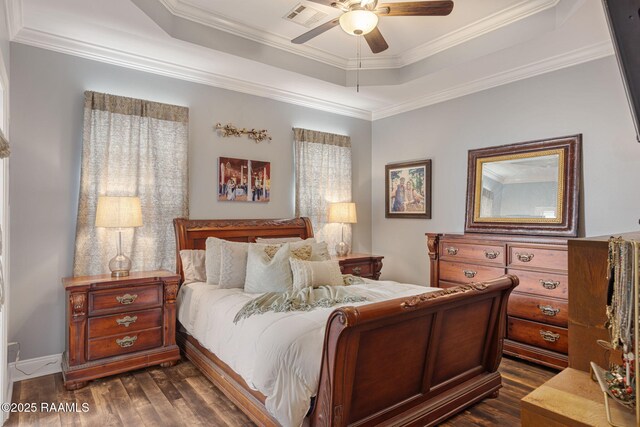 112 Sandhill Crane Dr, Lafayette, LA 70508 - bedroom with a tray ceiling, dark wood-type flooring, crown molding, and ceiling fan