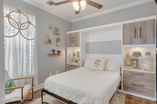 112 Sandhill Crane Dr, Lafayette, LA 70508 - bedroom featuring dark wood-style floors, crown molding, ceiling fan, and baseboards