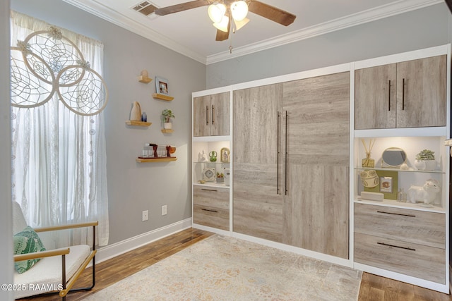 112 Sandhill Crane Dr, Lafayette, LA 70508 - living area featuring wood finished floors, ceiling fan, crown molding, and baseboards