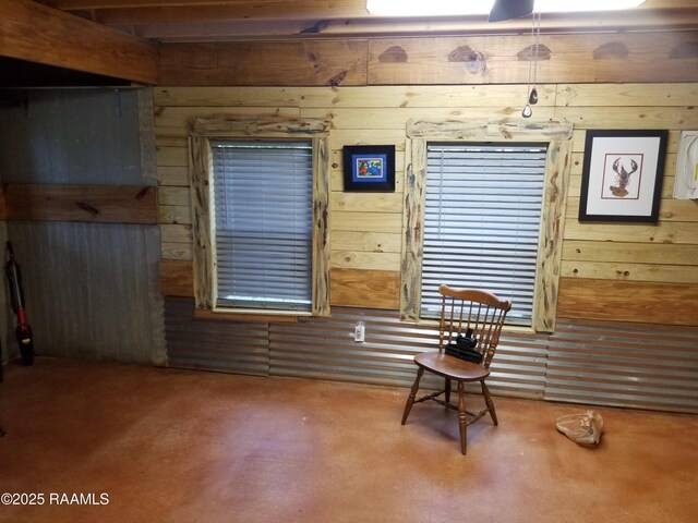 1462 Herman Dupuis Rd, Breaux Bridge, LA 70517 - living area featuring wood walls and finished concrete flooring