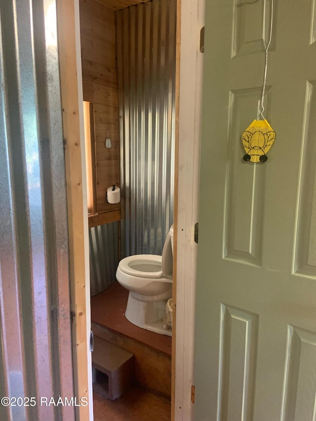1462 Herman Dupuis Rd, Breaux Bridge, LA 70517 - bathroom with toilet and wooden walls
