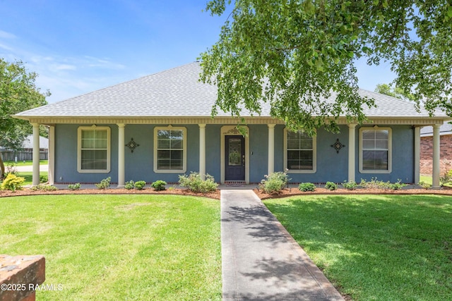 201 Rue Paon, Youngsville, LA 70592 - view of front of property featuring roof with shingles, stucco siding, a front lawn, and covered porch