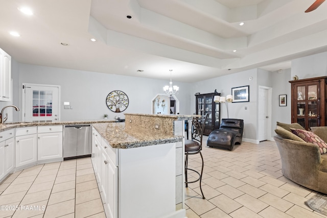 201 Rue Paon, Youngsville, LA 70592 - kitchen with dishwasher, open floor plan, a breakfast bar, recessed lighting, and light tile patterned floors