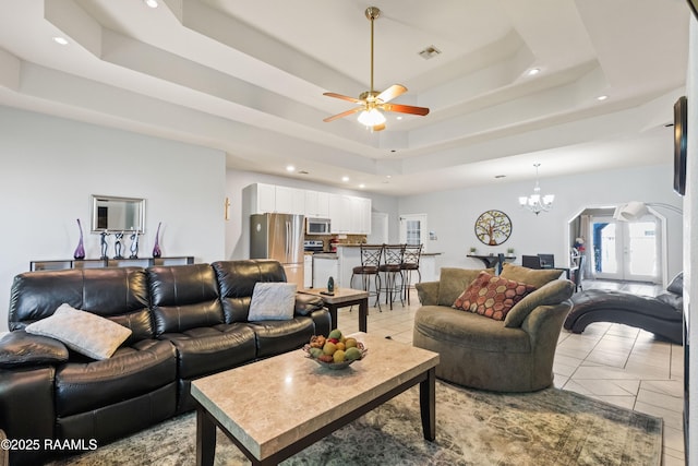 201 Rue Paon, Youngsville, LA 70592 - living area with a tray ceiling, a chandelier, ceiling fan, recessed lighting, and light tile patterned floors
