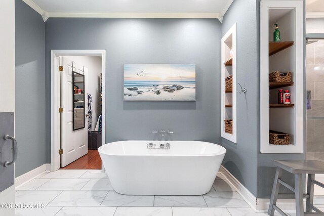 201 Rue Paon, Youngsville, LA 70592 - bathroom with a freestanding bath, crown molding, marble look tiles, and baseboards