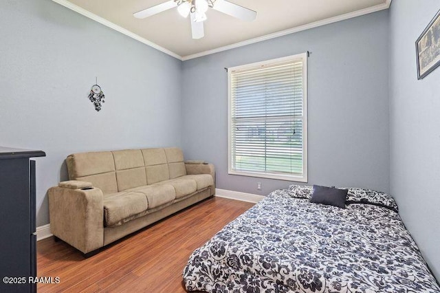201 Rue Paon, Youngsville, LA 70592 - bedroom featuring wood finished floors, ornamental molding, baseboards, and a ceiling fan