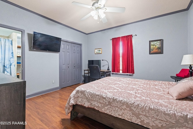 201 Rue Paon, Youngsville, LA 70592 - bedroom with crown molding, wood finished floors, a closet, and ceiling fan