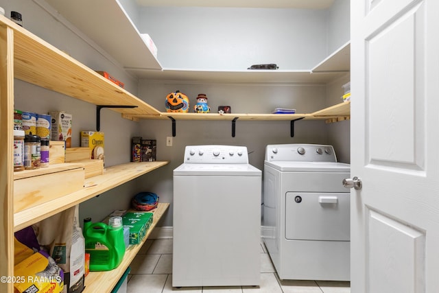 201 Rue Paon, Youngsville, LA 70592 - laundry room with light tile patterned flooring and washer and clothes dryer