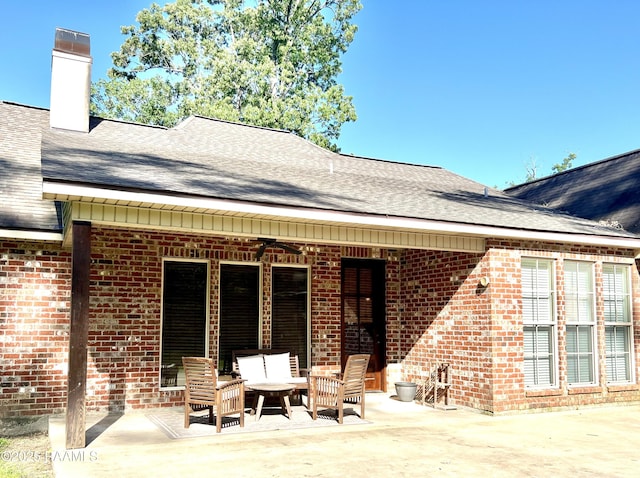 277 Carrera Ln, Eunice, LA 70535 - back of house featuring brick siding, a patio area, and roof with shingles