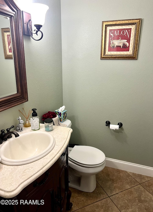 277 Carrera Ln, Eunice, LA 70535 - bathroom featuring vanity, tile patterned floors, toilet, and baseboards