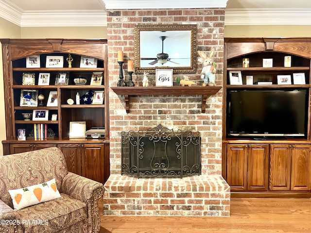 277 Carrera Ln, Eunice, LA 70535 - living room with light wood finished floors, ceiling fan, crown molding, and a fireplace
