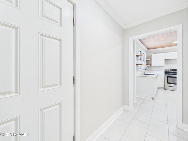 1206 Kaliste Saloom Rd, Lafayette, LA 70508 - hallway with crown molding, a sink, and baseboards