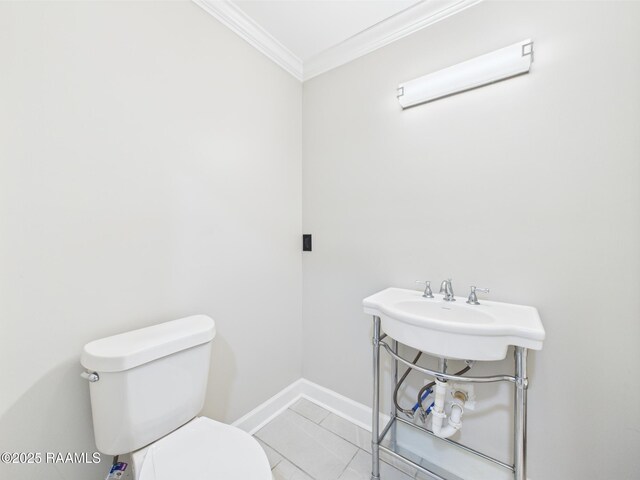 1206 Kaliste Saloom Rd, Lafayette, LA 70508 - bathroom with crown molding, toilet, and baseboards