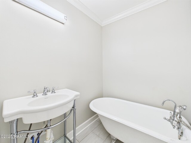 1206 Kaliste Saloom Rd, Lafayette, LA 70508 - bathroom featuring a freestanding tub, ornamental molding, and baseboards