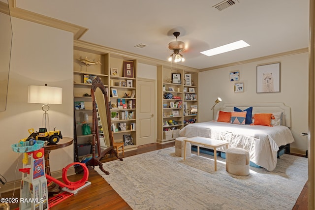 315 Kings Rd, Lafayette, LA 70503 - bedroom featuring ornamental molding, wood finished floors, and a skylight