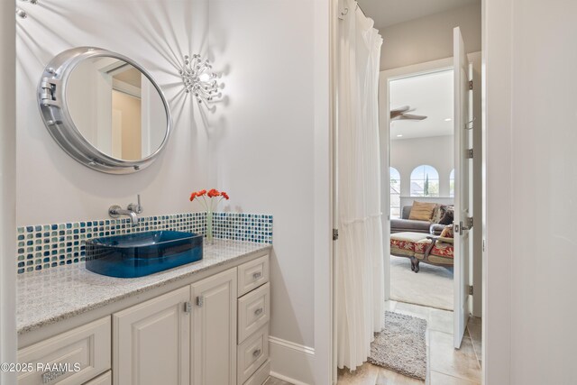 408 Princeton Woods Loop, Lafayette, LA 70508 - bathroom featuring backsplash, vanity, and tile patterned flooring