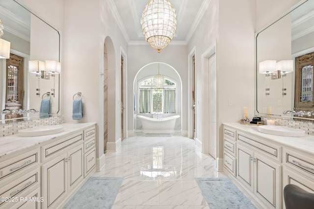 408 Princeton Woods Loop, Lafayette, LA 70508 - full bathroom with a chandelier, marble tiled floors, tasteful backsplash, two vanities, and crown molding