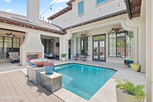 408 Princeton Woods Loop, Lafayette, LA 70508 - swimming pool with french doors, ceiling fan, an outdoor living space with a fireplace, and a patio area