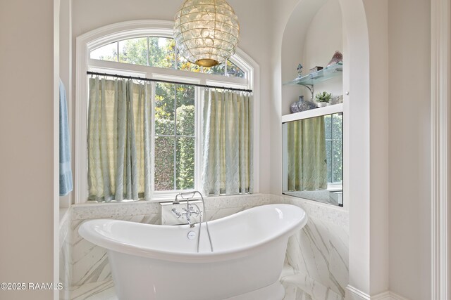 408 Princeton Woods Loop, Lafayette, LA 70508 - bathroom featuring marble tiled flooring and a soaking tub