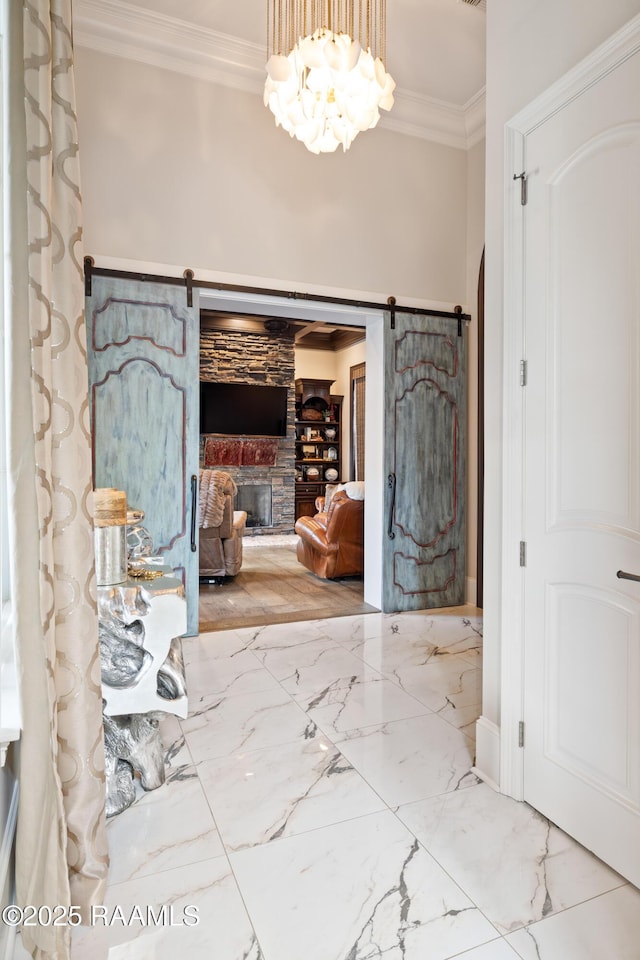 408 Princeton Woods Loop, Lafayette, LA 70508 - entrance foyer with ornamental molding, marble tiled floors, a fireplace, and a barn door