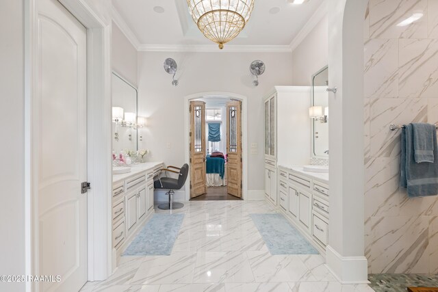 408 Princeton Woods Loop, Lafayette, LA 70508 - bathroom featuring crown molding, marble finish floors, two vanities, a chandelier, and ensuite bath