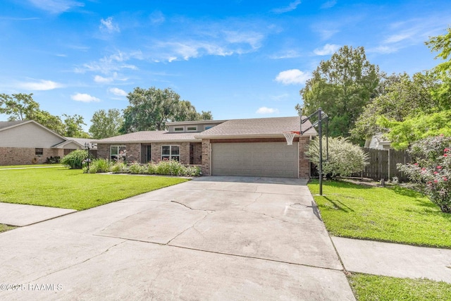 109 Bellevedere Ave, Lafayette, LA 70503 - view of front of house with an attached garage, brick siding, driveway, and roof with shingles